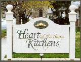 carved sign heart of the home kitchens